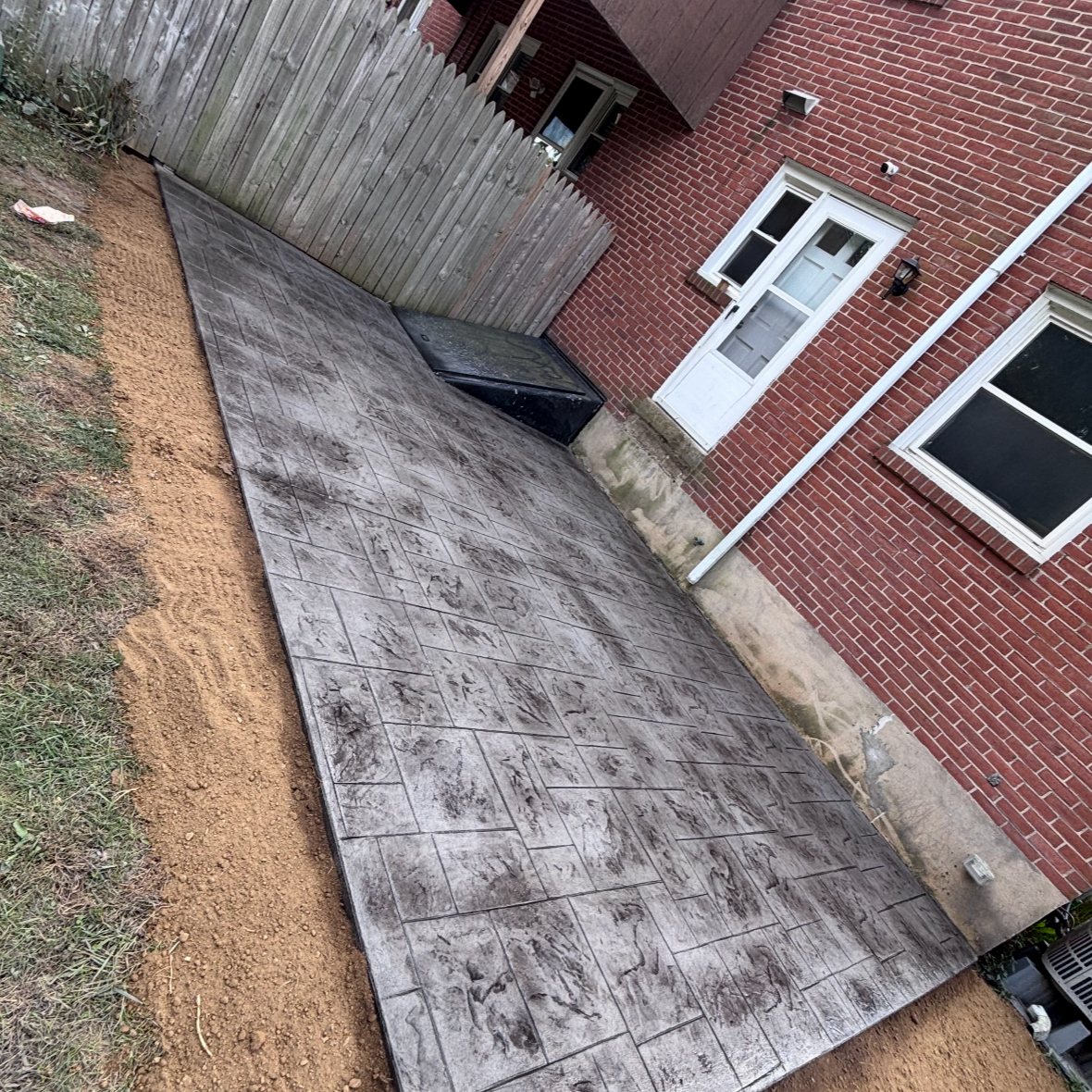 Decorative stamped patio completed by T-Bones Concrete