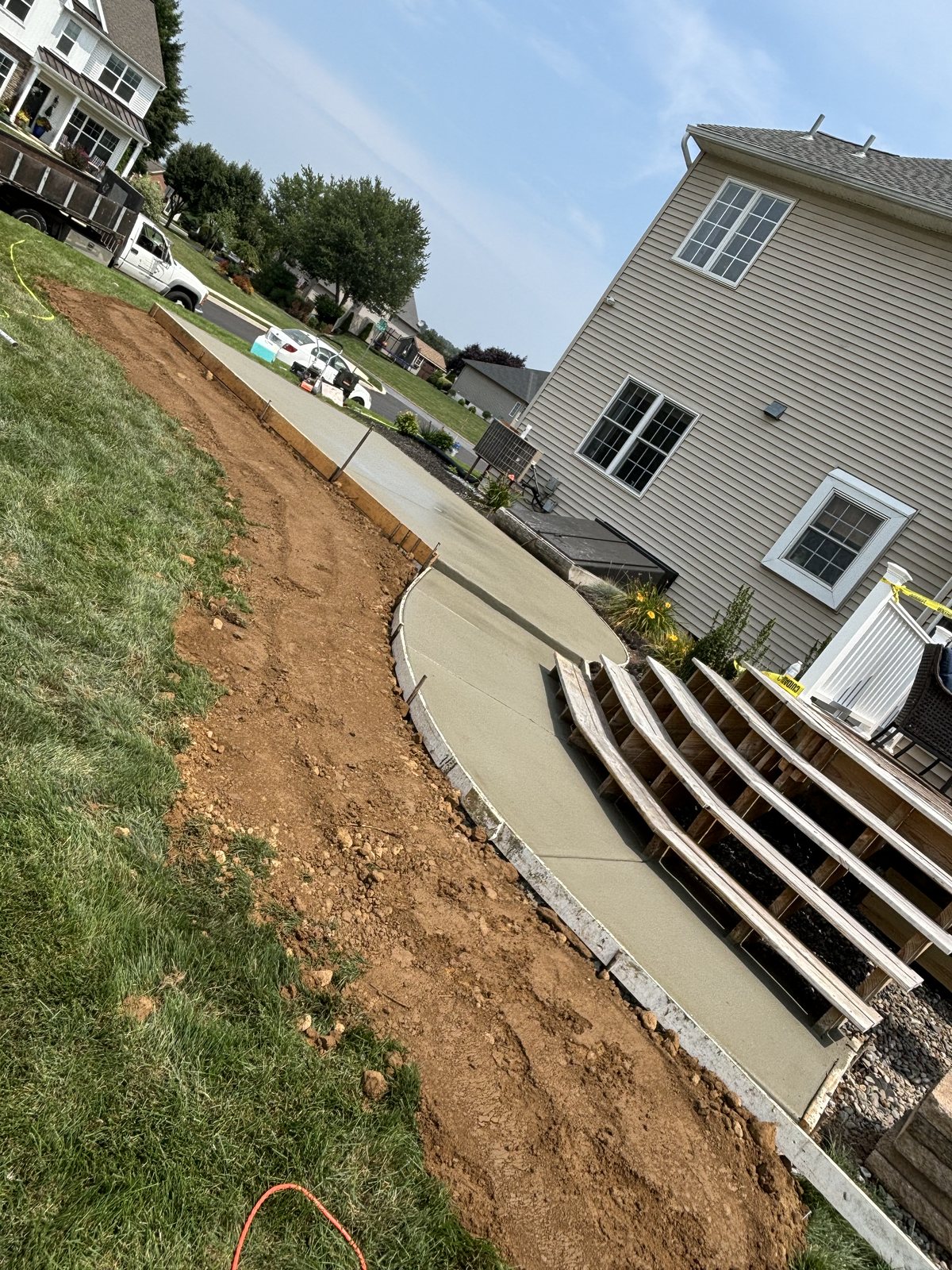 Backyard patio + steps completed by T-Bones Concrete