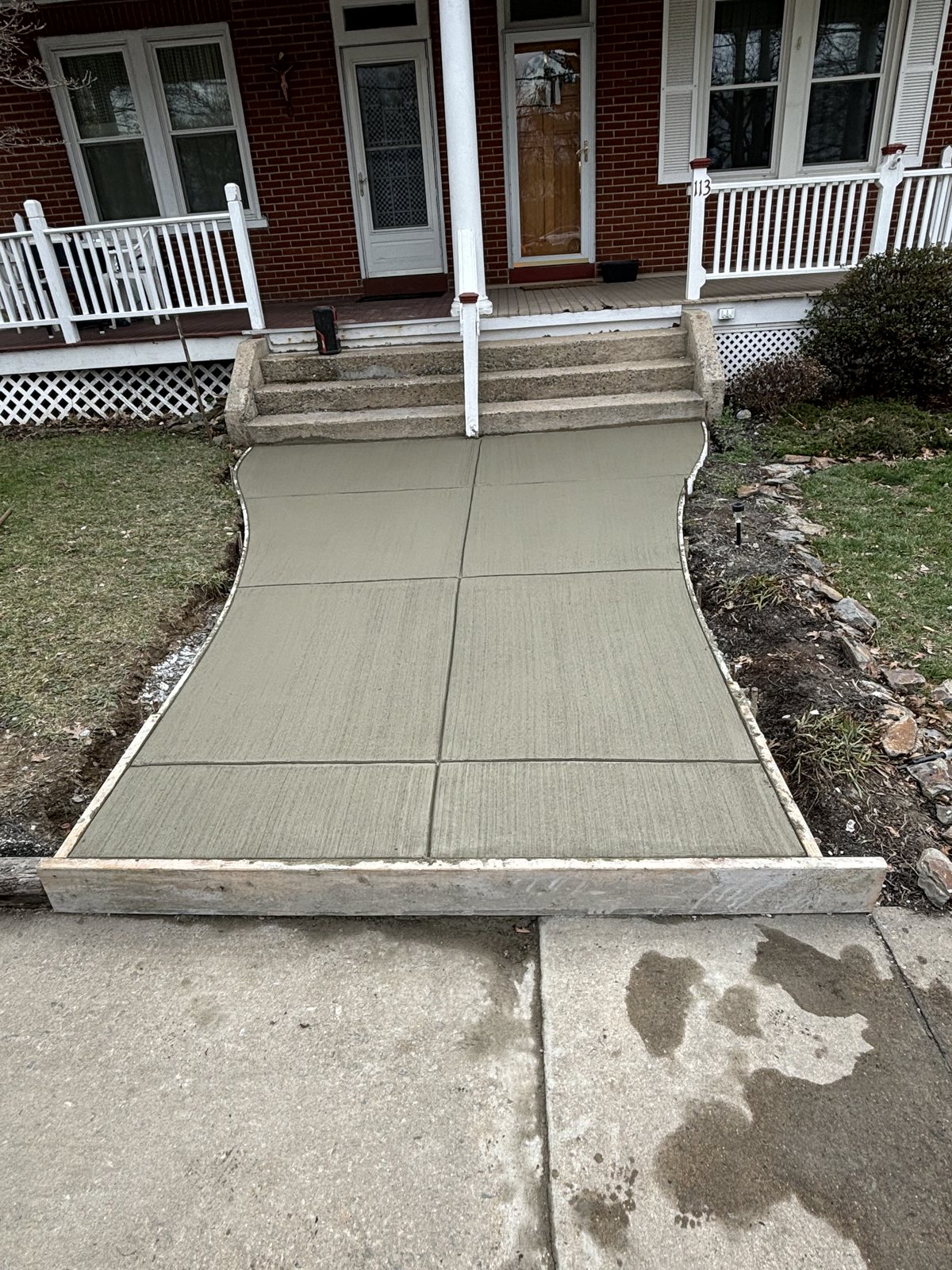 Front walk + landing completed by T-Bones Concrete