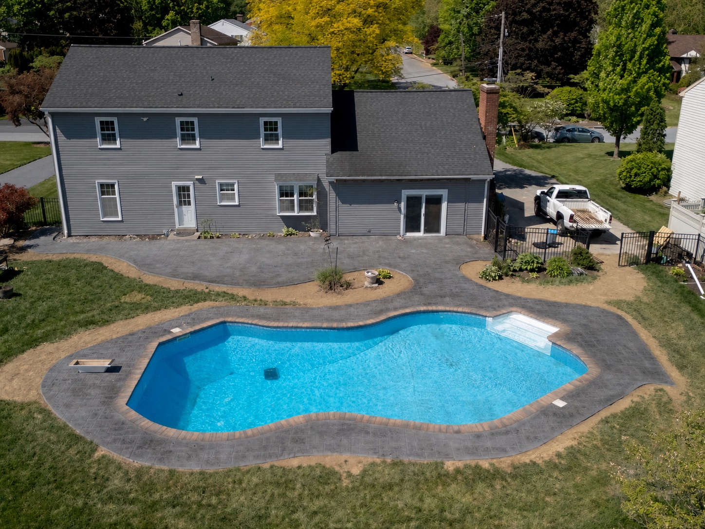 Stamped pool deck completed by T-Bones Concrete